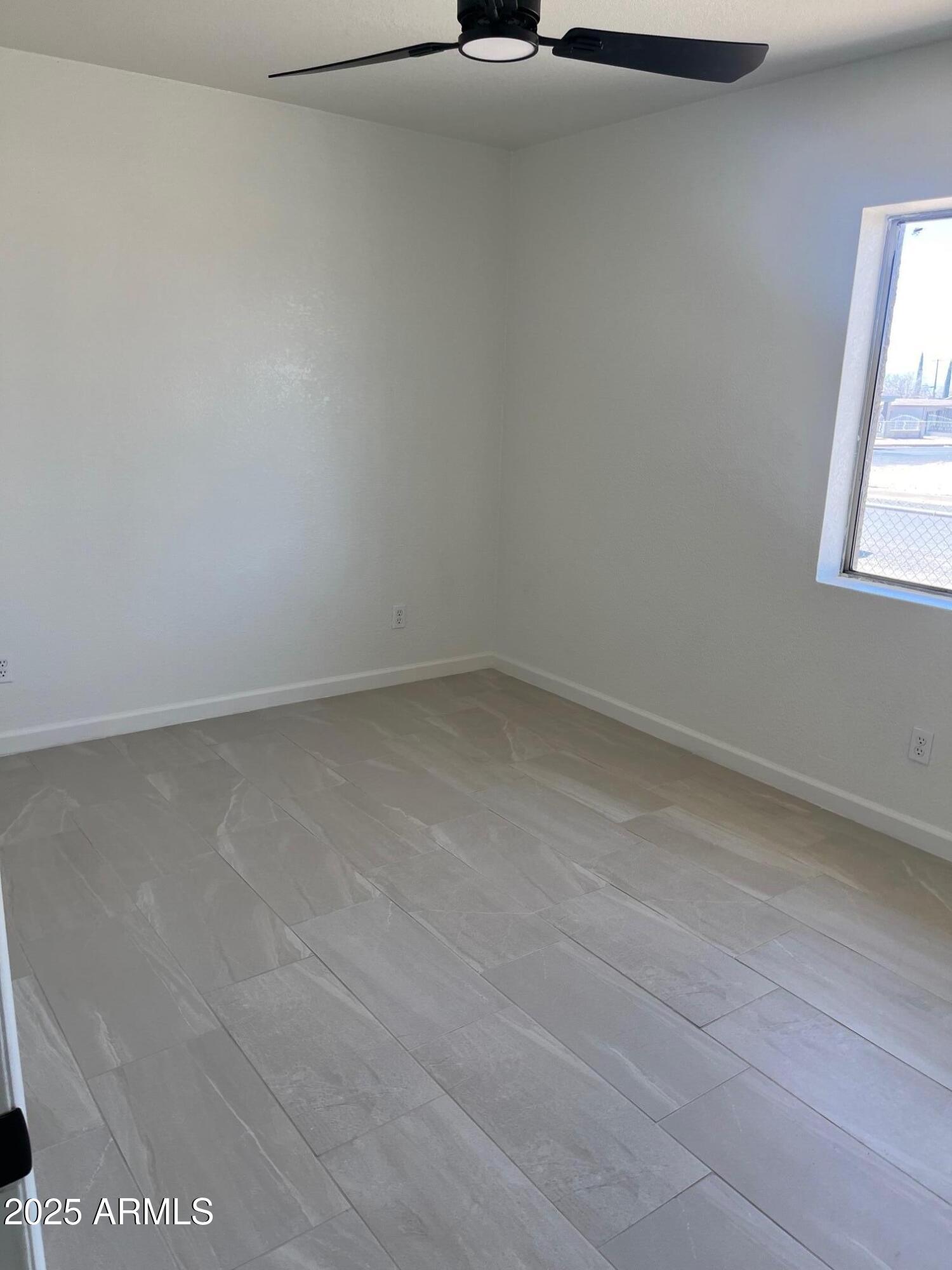 810 East 3rd Street Douglas, AZ 85607 - Photo 9 of 12 an empty room with a window