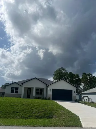 a view of house with yard and entertaining space