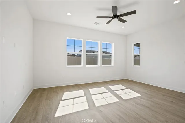 a spacious bathroom with a double vanity sink a large mirror and shower
