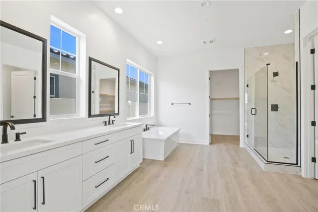 an empty room with a window and a ceiling fan