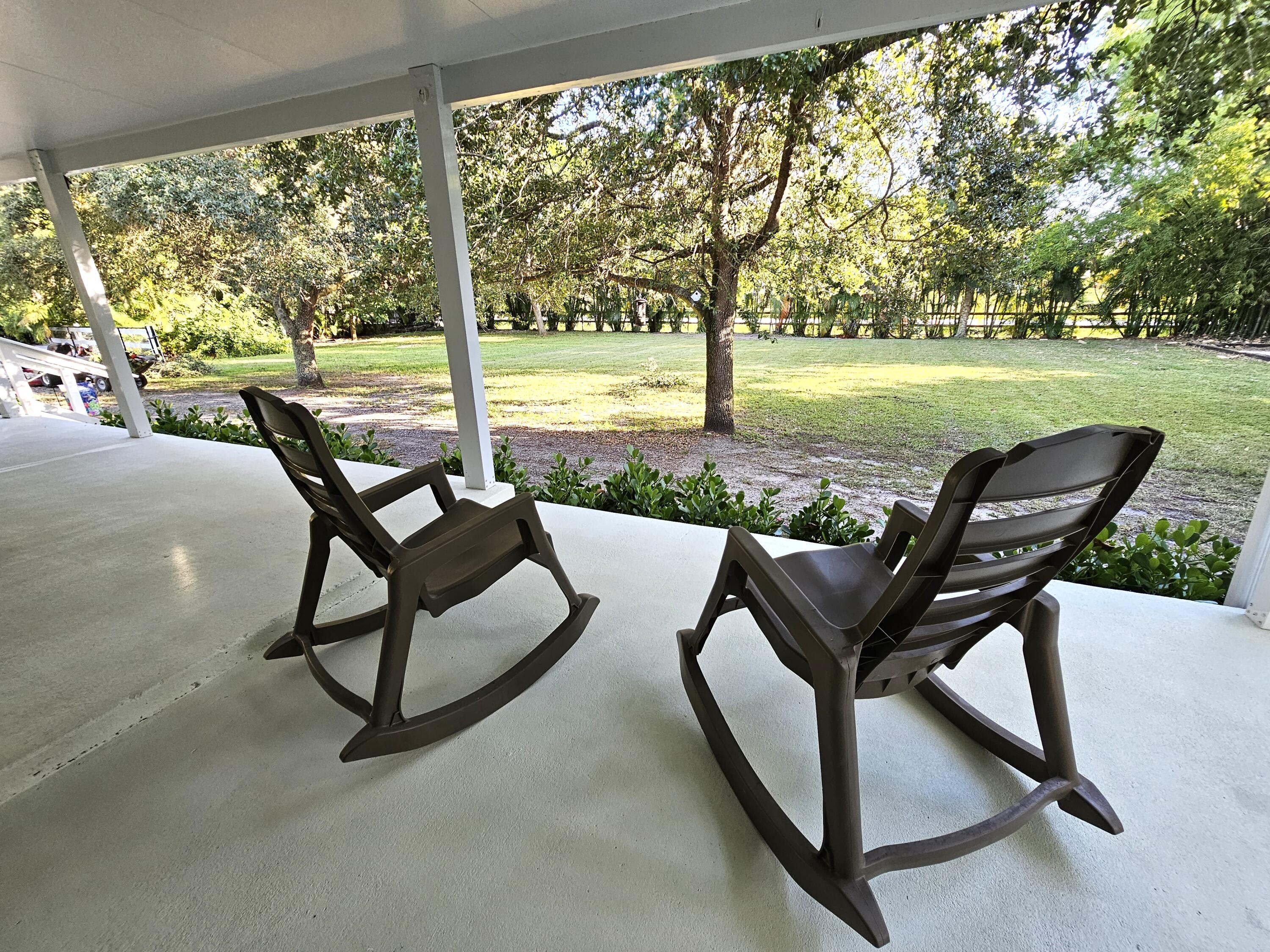 12575 52nd Road North The Acreage, FL 33411 - Photo 1 of 65 View of front lawn from patio