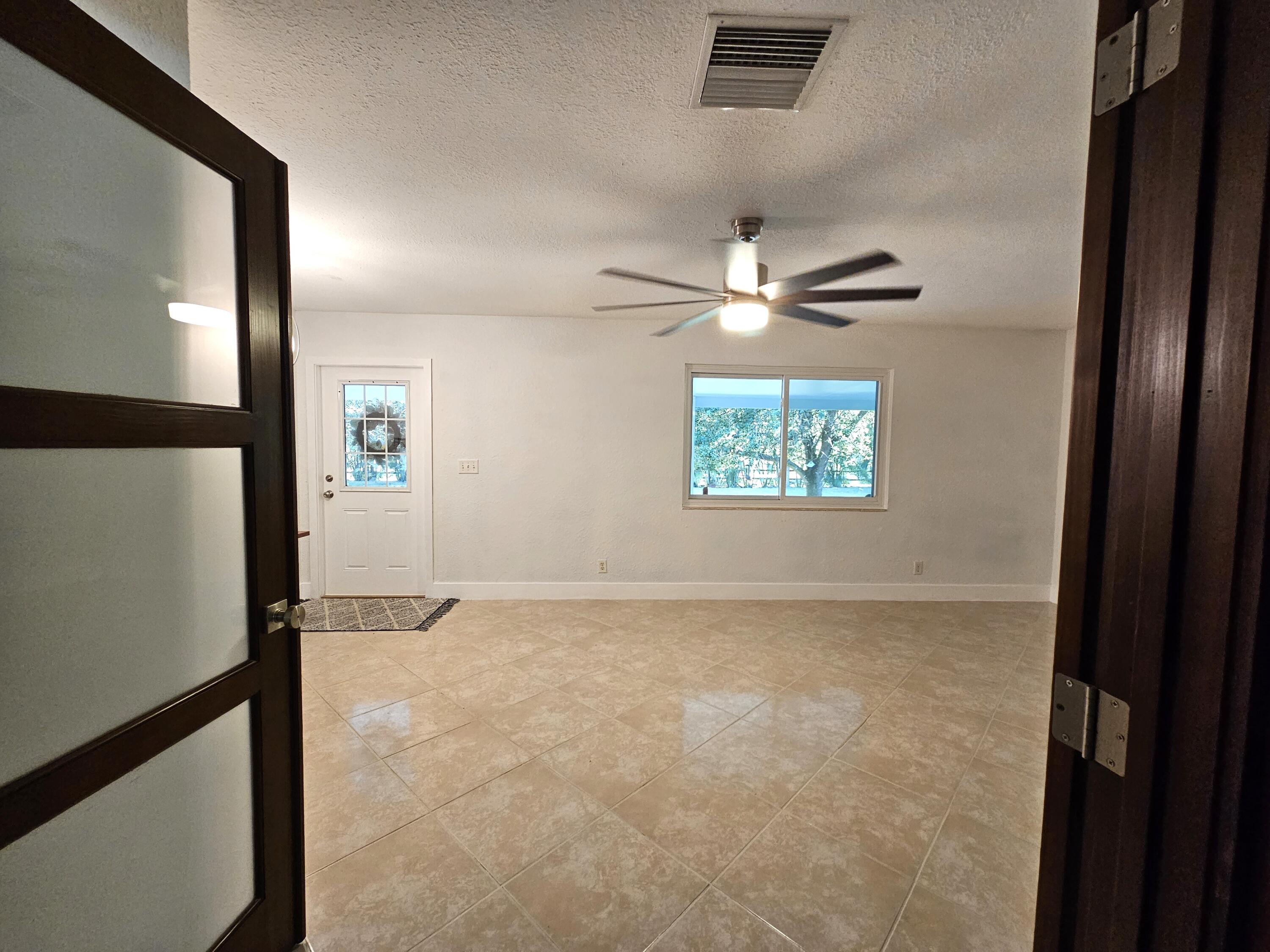 12575 52nd Road North The Acreage, FL 33411 - Photo 11 of 65 View of living room from kitchen