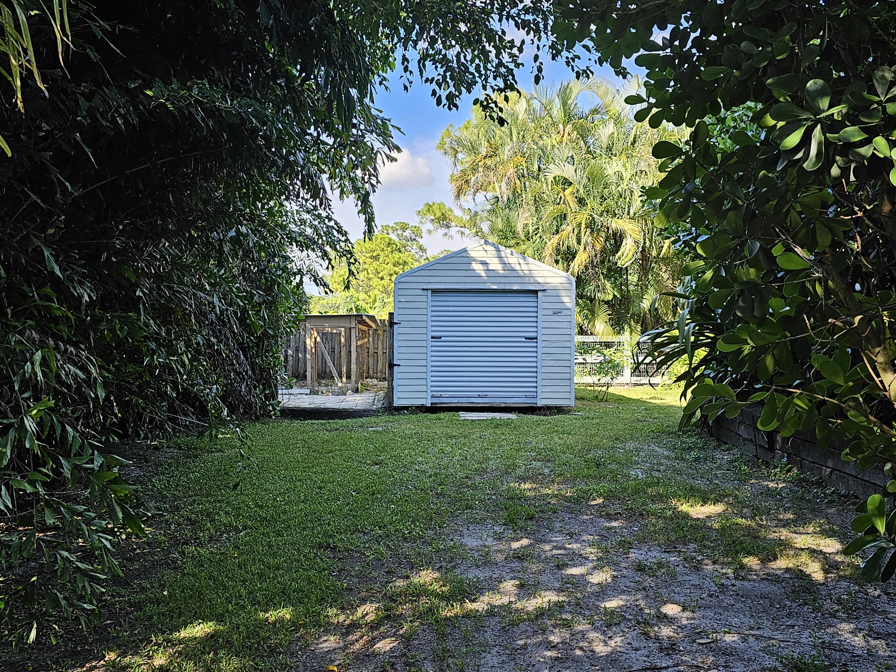 12575 52nd Road North The Acreage, FL 33411 - Photo 48 of 65 Rear shed with electric