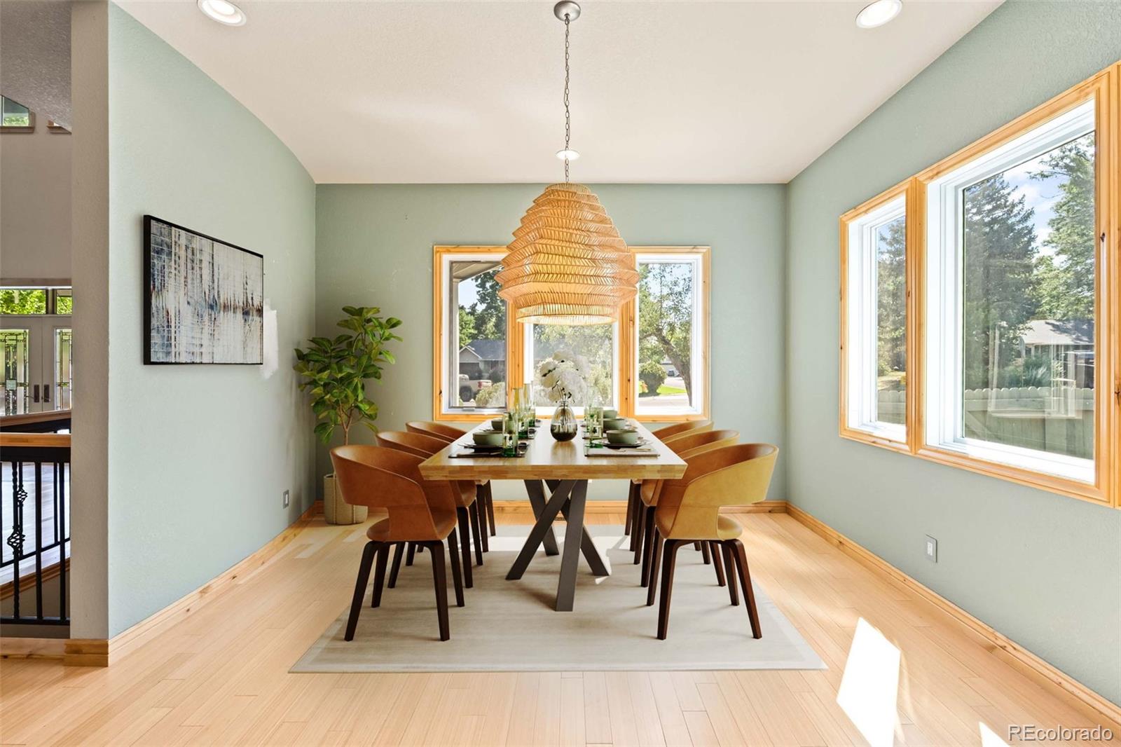 2895 South Cook Street Denver, CO 80210 - Photo 13 of 41 a view of a dining room with furniture window and wooden floor