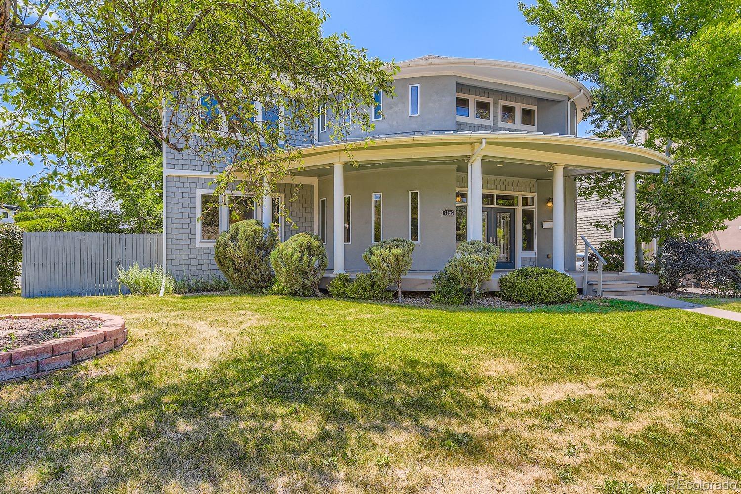2895 South Cook Street Denver, CO 80210 - Photo 2 of 41 a front view of a house with garden