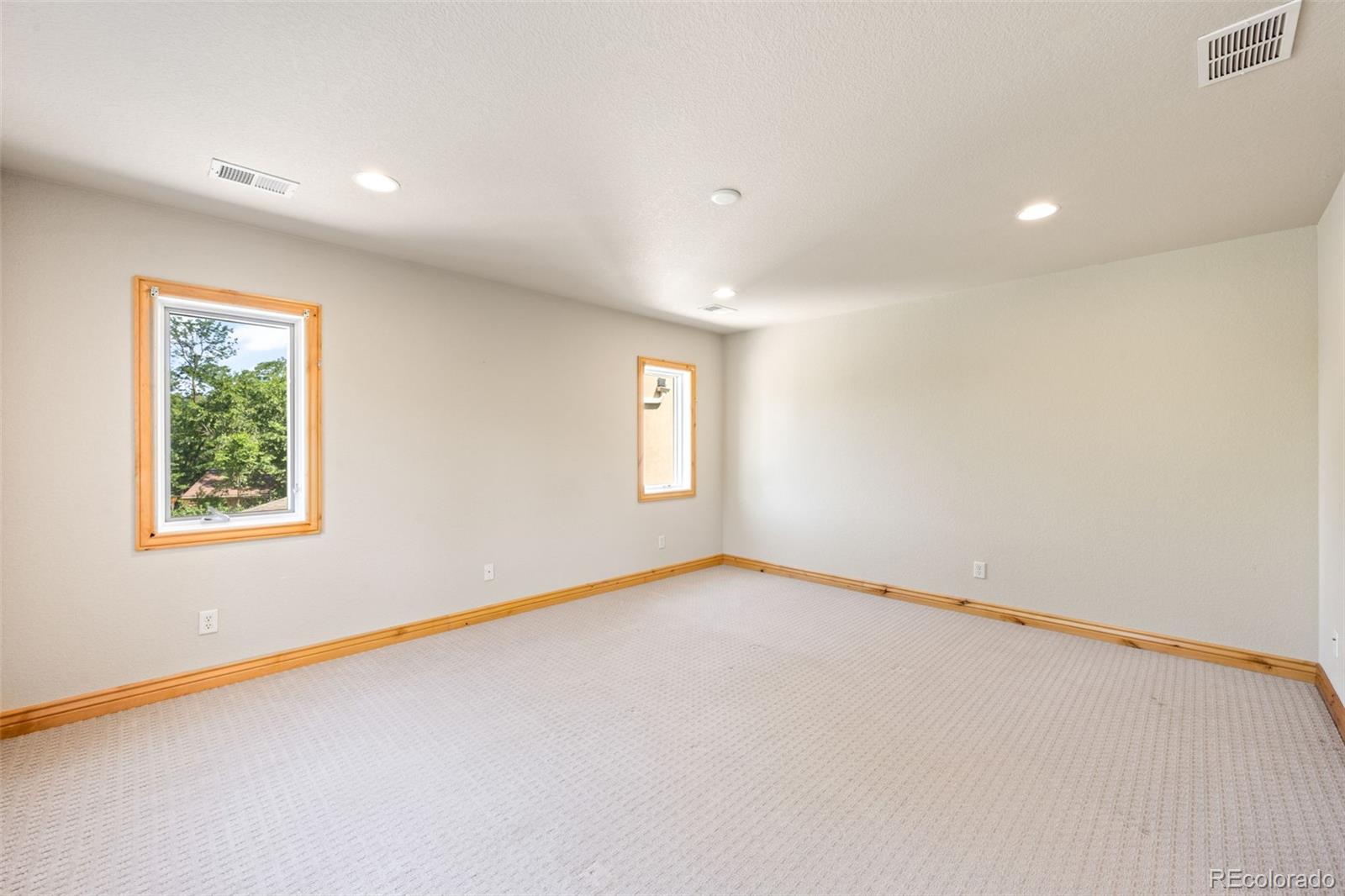 2895 South Cook Street Denver, CO 80210 - Photo 25 of 41 an empty room with a window