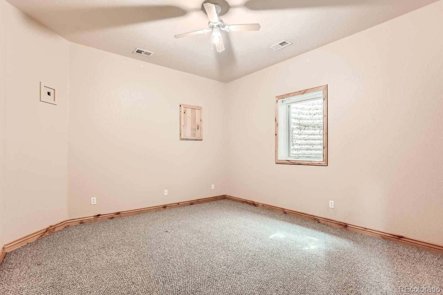 2895 South Cook Street Denver, CO 80210 - Photo 35 of 41 a view of an empty room with a window