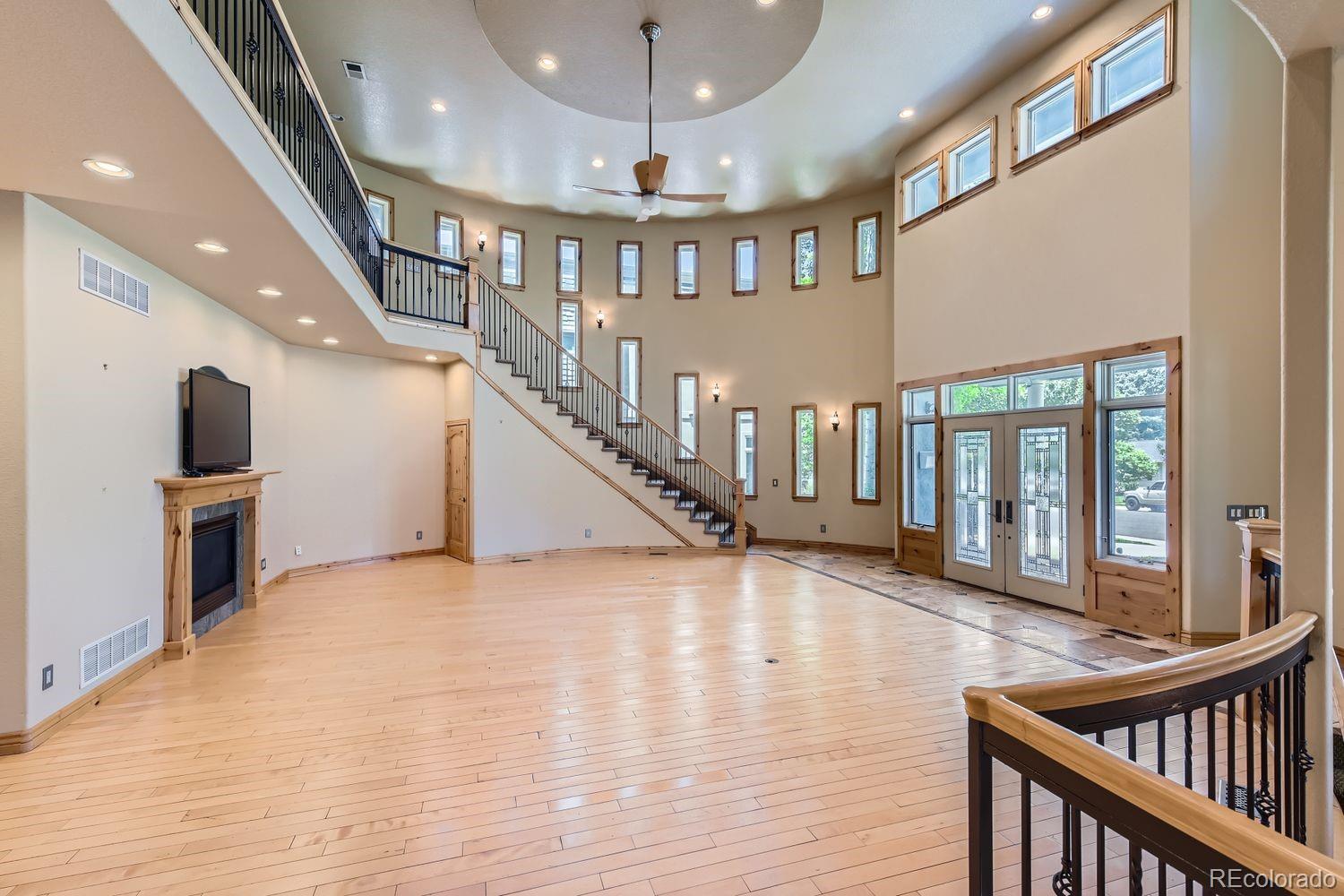 2895 South Cook Street Denver, CO 80210 - Photo 6 of 41 a view of staircase with lots of wooden floor and dining room