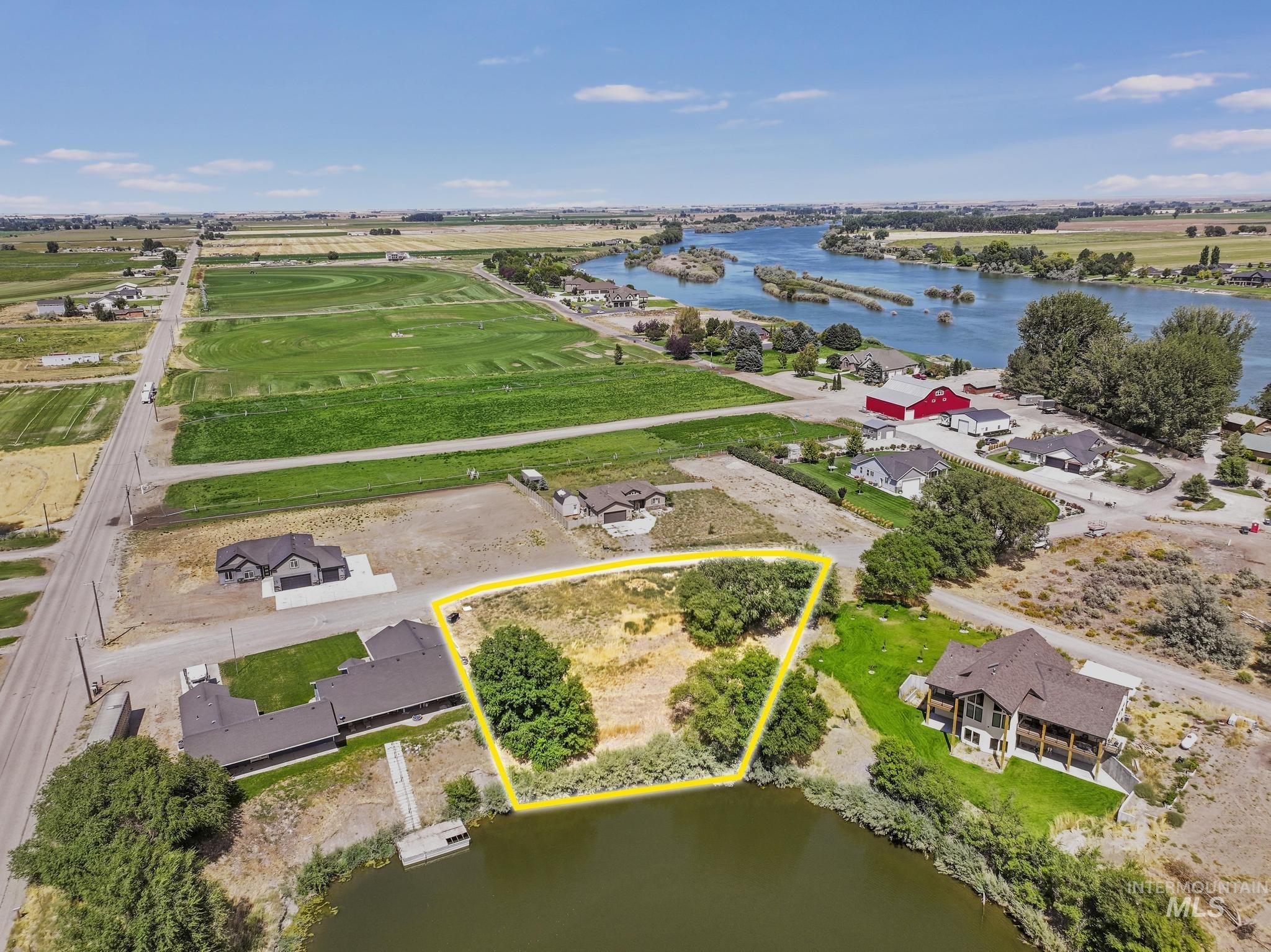 Tbd Tbd Rupert, ID 83350 - Photo 16 of 26 Aerial view of residential area featuring a large body of water and property parcel outlined