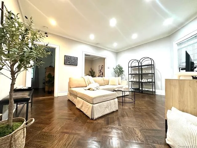 a living room with furniture and a window