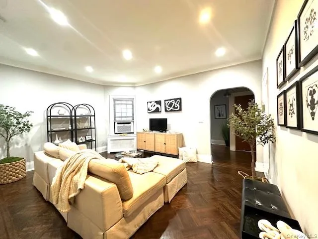 a bedroom with bed and a large window