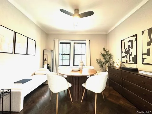 a dining room with furniture and window