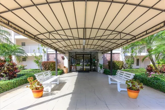 a front view of a house with outdoor seating