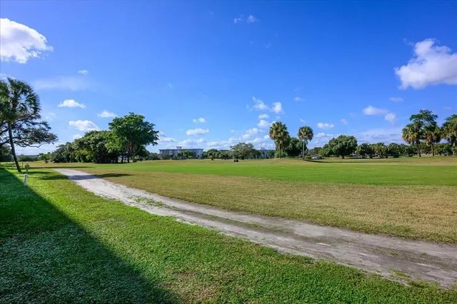 a view of a golf course with a lake
