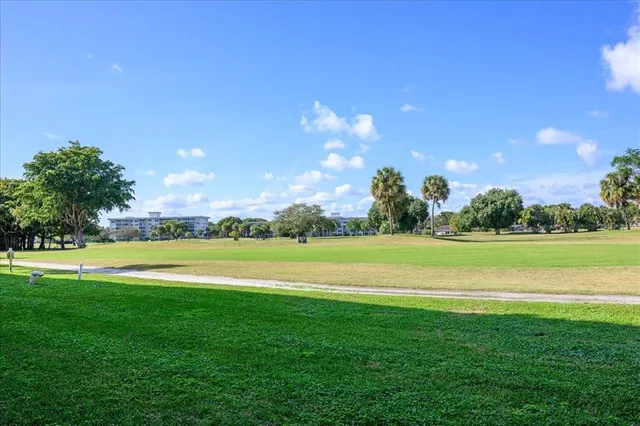 a view of a golf course with a lake view
