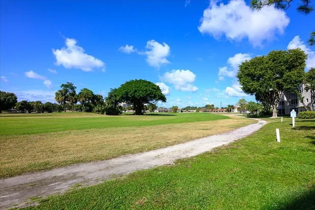 a view of a golf course with a lake view