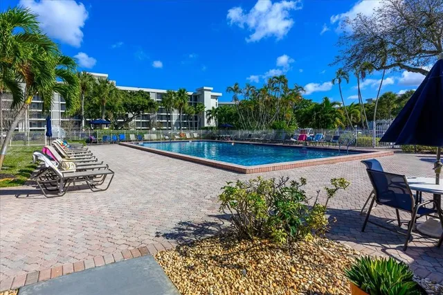 a view of a backyard with sitting area