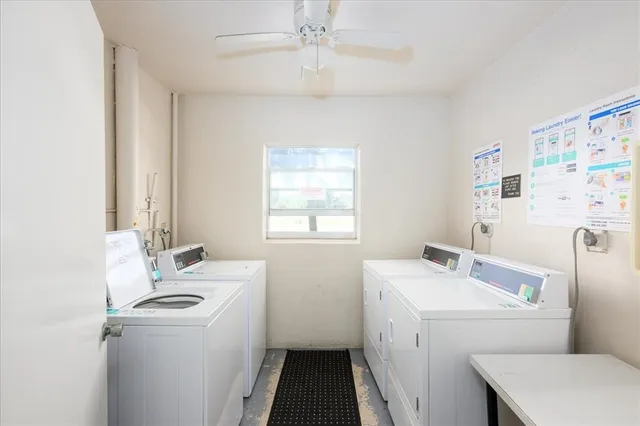 a bathroom with a sink a toilet and a window