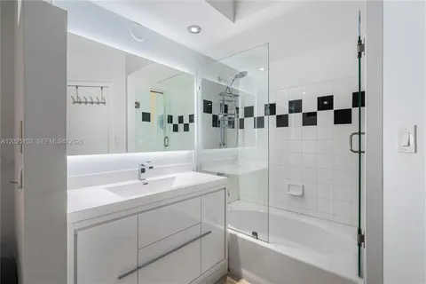 a bathroom with a bathtub and a sink