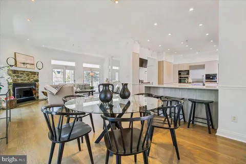 a view of a dining room with furniture and a fireplace