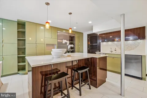 a kitchen with a table and chairs in it
