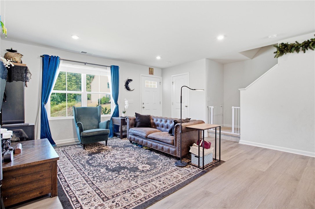 112 Wls Sta Road Seneca, SC 29678 - Photo 8 of 42 Gleaming hardwood floors and recessed lighting anchor this open and airy main living space.