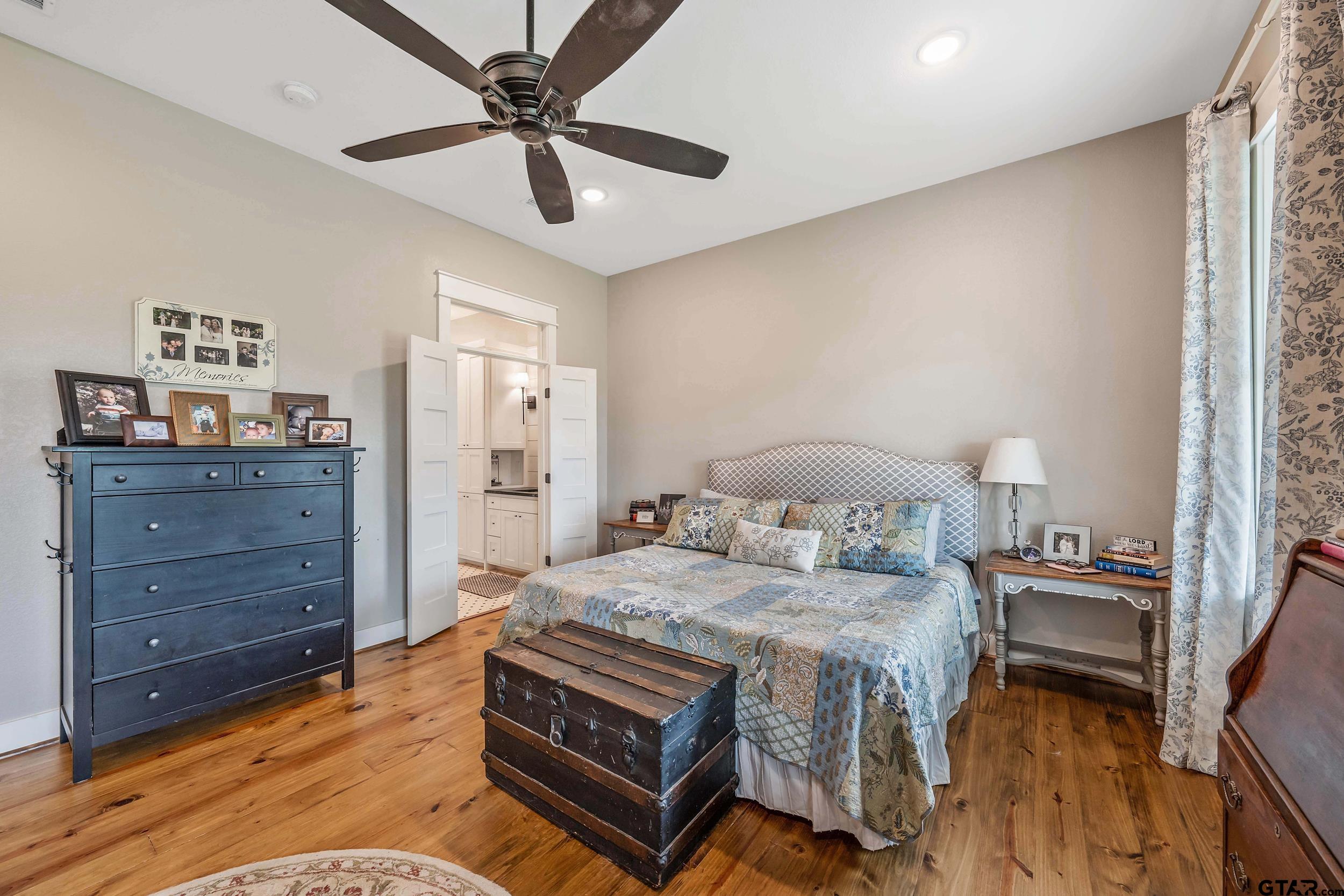 3022 County Road 3802 Bullard, TX 75757 - Photo 16 of 46 a bedroom with a bed and a table