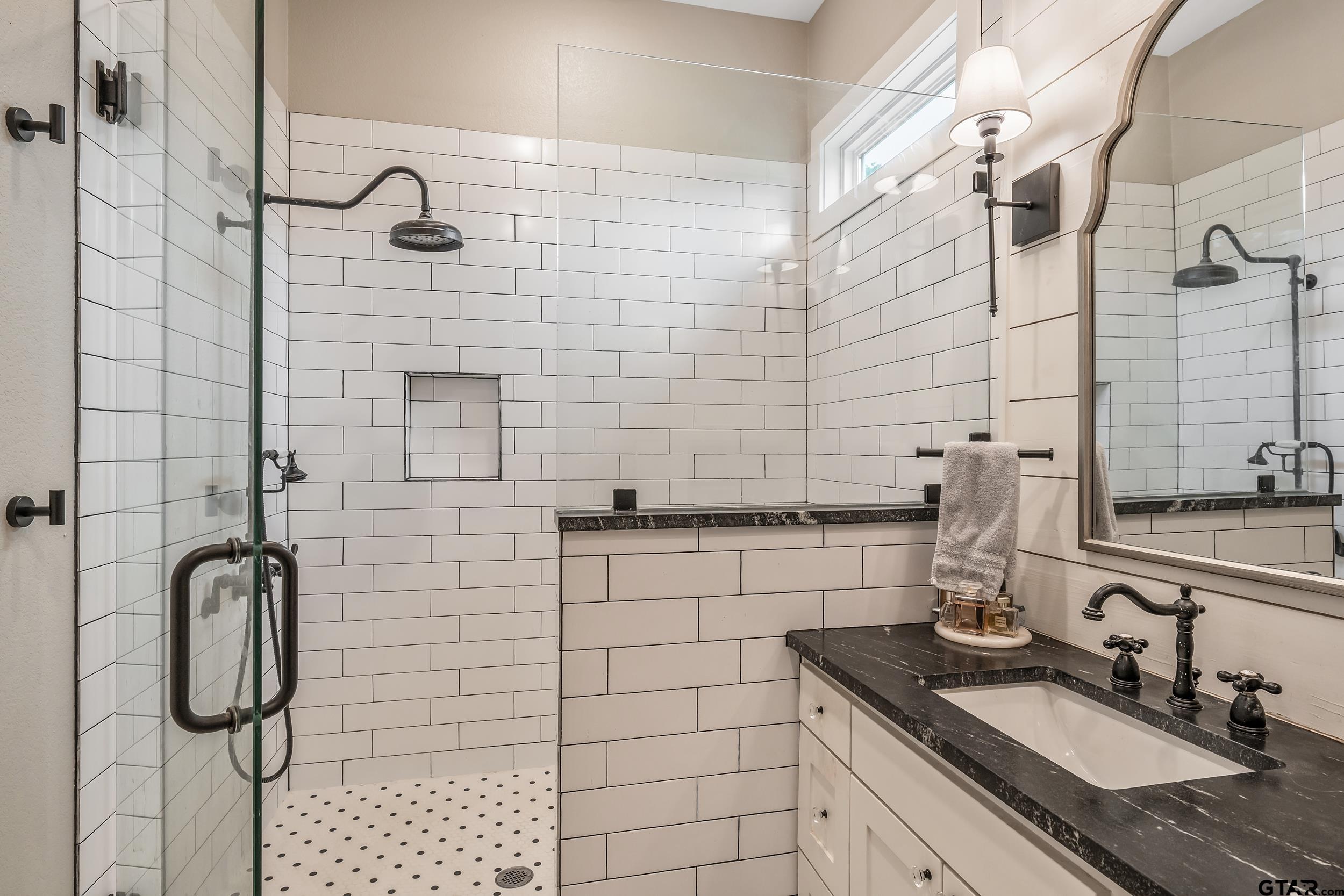 3022 County Road 3802 Bullard, TX 75757 - Photo 19 of 46 a bathroom with a sink shower and a mirror