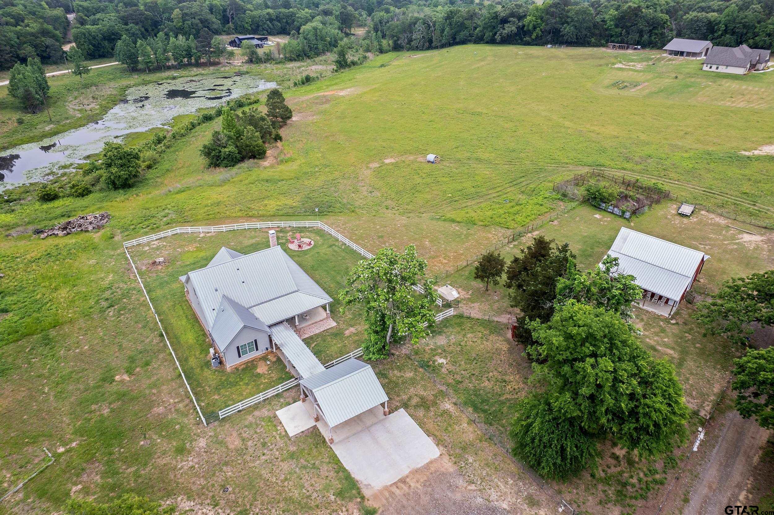 3022 County Road 3802 Bullard, TX 75757 - Photo 44 of 46 an aerial view of a houses with a yard