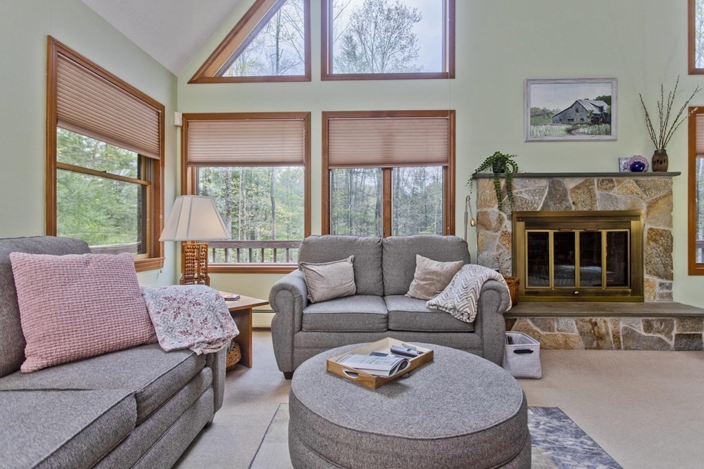 583 Williamsburg Road Conway, MA 01096 - Photo 14 of 38 a living room with furniture a fireplace and a large window