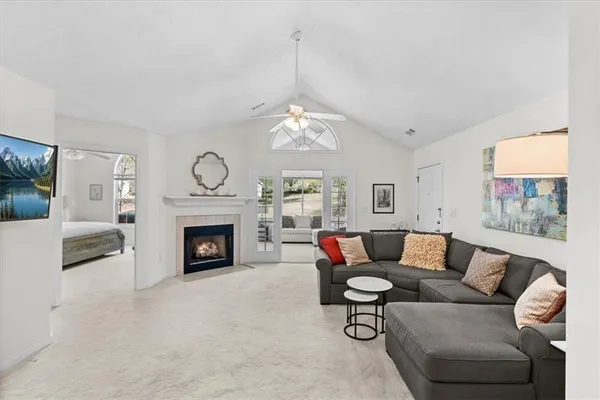 a living room with furniture and a fireplace