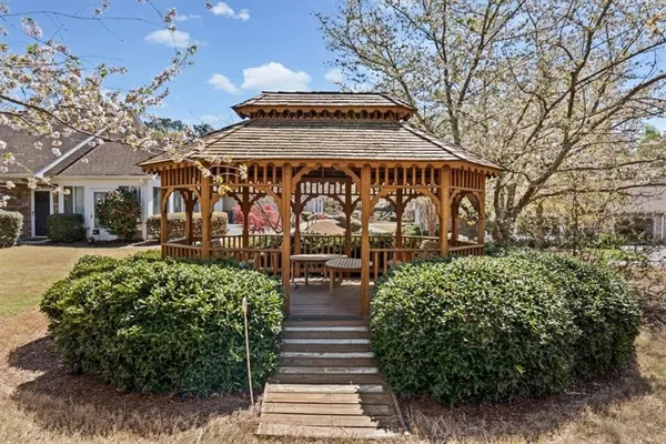 a front view of a building with garden