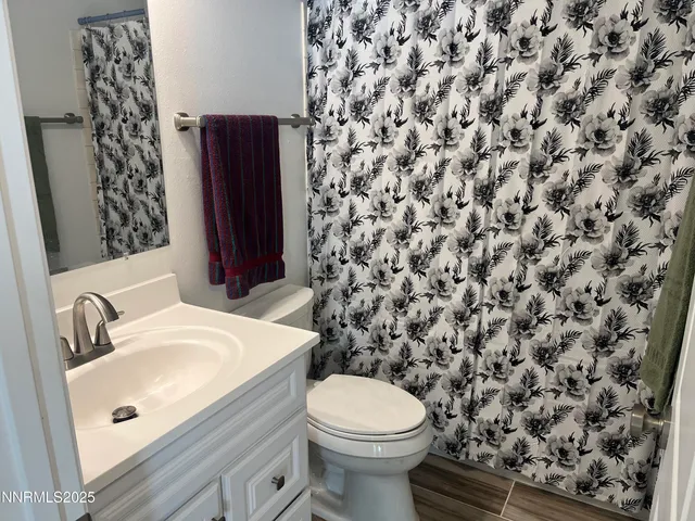 a bathroom with a toilet and a sink