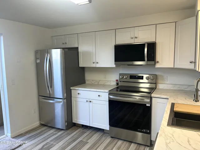 a kitchen with a stove microwave and refrigerator