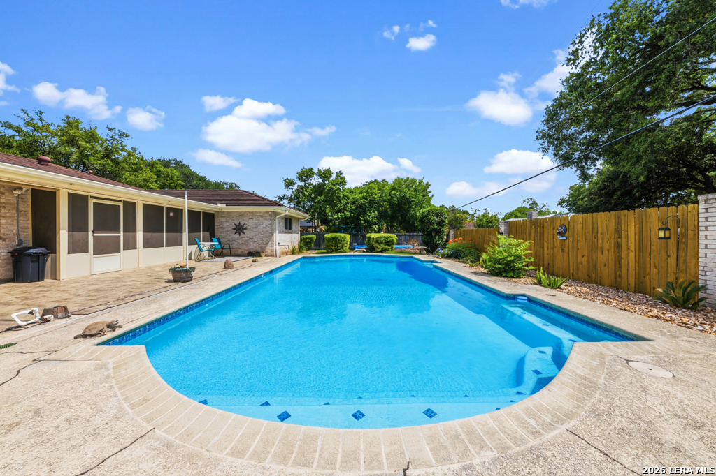6022 Winding Ridge Drive Windcrest, TX 78239 - Photo 28 of 31 a swimming pool with outdoor seating and yard
