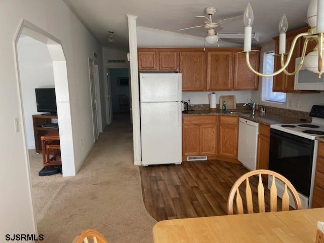 94 Center Drive Ocean View, NJ 08230 - Photo 6 of 12 a kitchen with kitchen island a stove a refrigerator and a sink