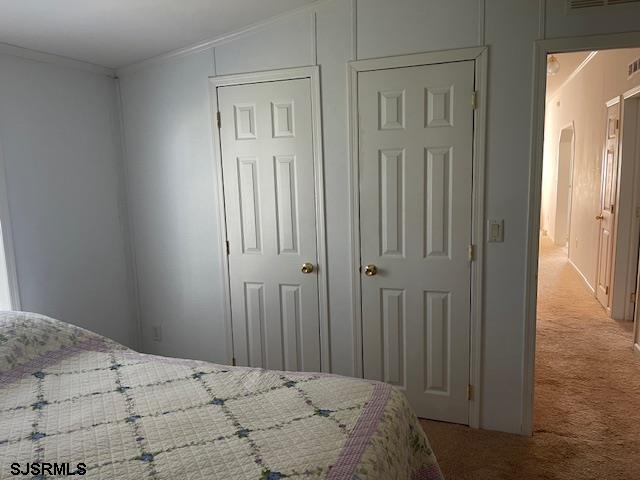 94 Center Drive Ocean View, NJ 08230 - Photo 8 of 12 a bedroom with a bed and a closet