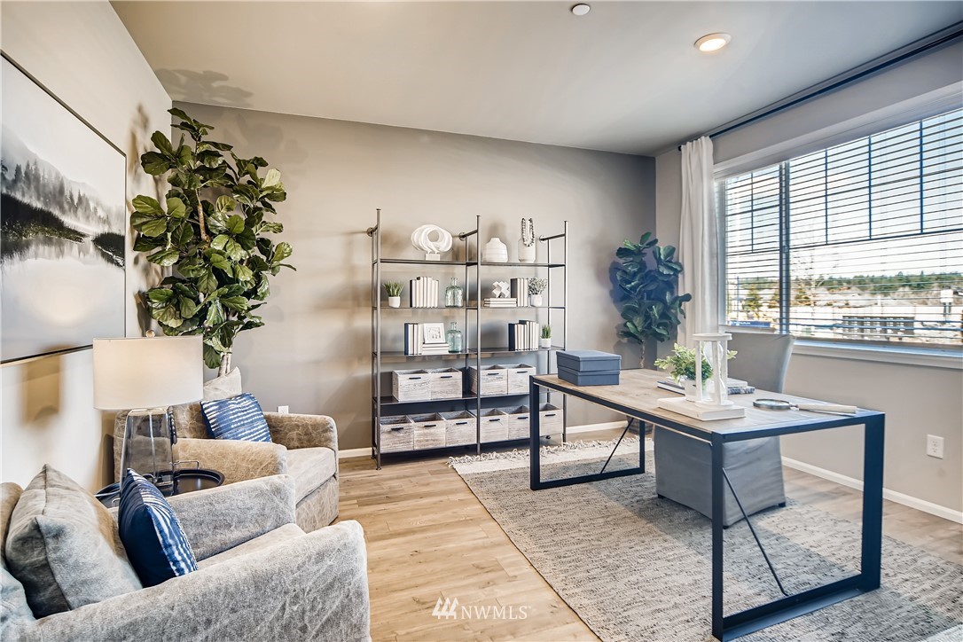 8812 Northeast 199th Street, Unit 1 Bothell, WA 98011 - Photo 19 of 31 a living room with furniture and a large window