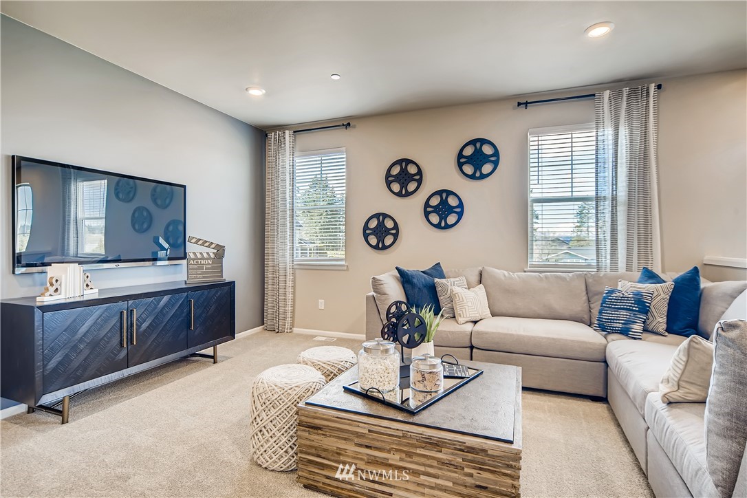 8812 Northeast 199th Street, Unit 1 Bothell, WA 98011 - Photo 25 of 31 a living room with furniture and a window