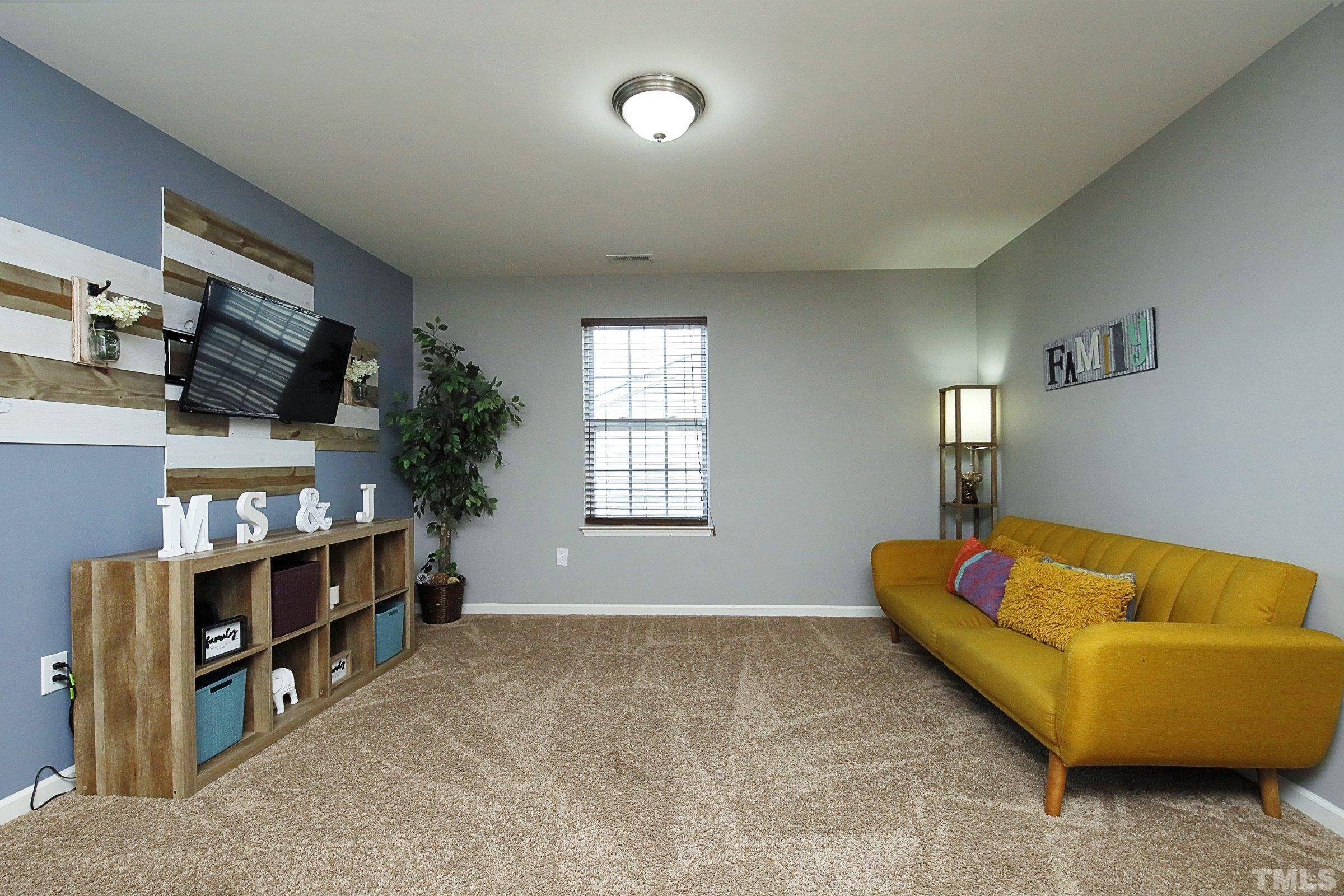 3617 Waleback Lane Raleigh, NC 27610 - Photo 19 of 34 a living room with furniture and a window