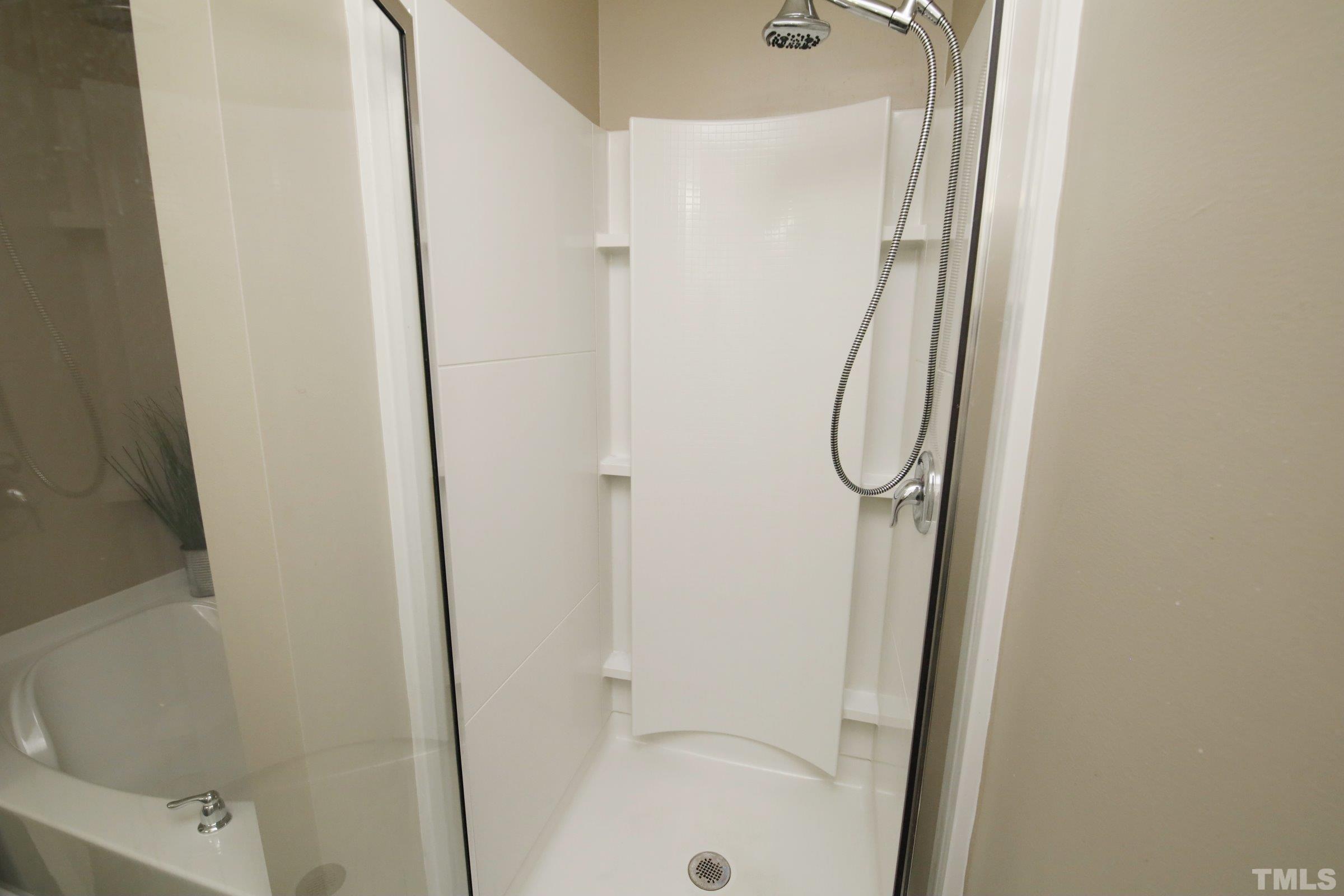 3617 Waleback Lane Raleigh, NC 27610 - Photo 24 of 34 a bathroom with a bathtub and a shower