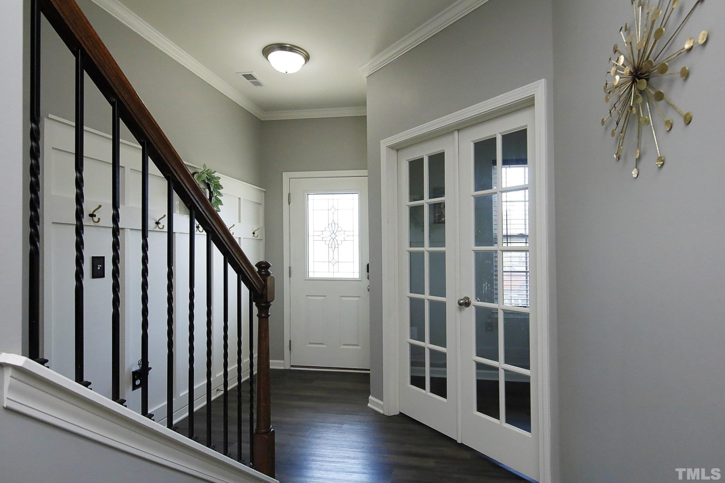3617 Waleback Lane Raleigh, NC 27610 - Photo 3 of 34 an entryway with wooden floor and stairs