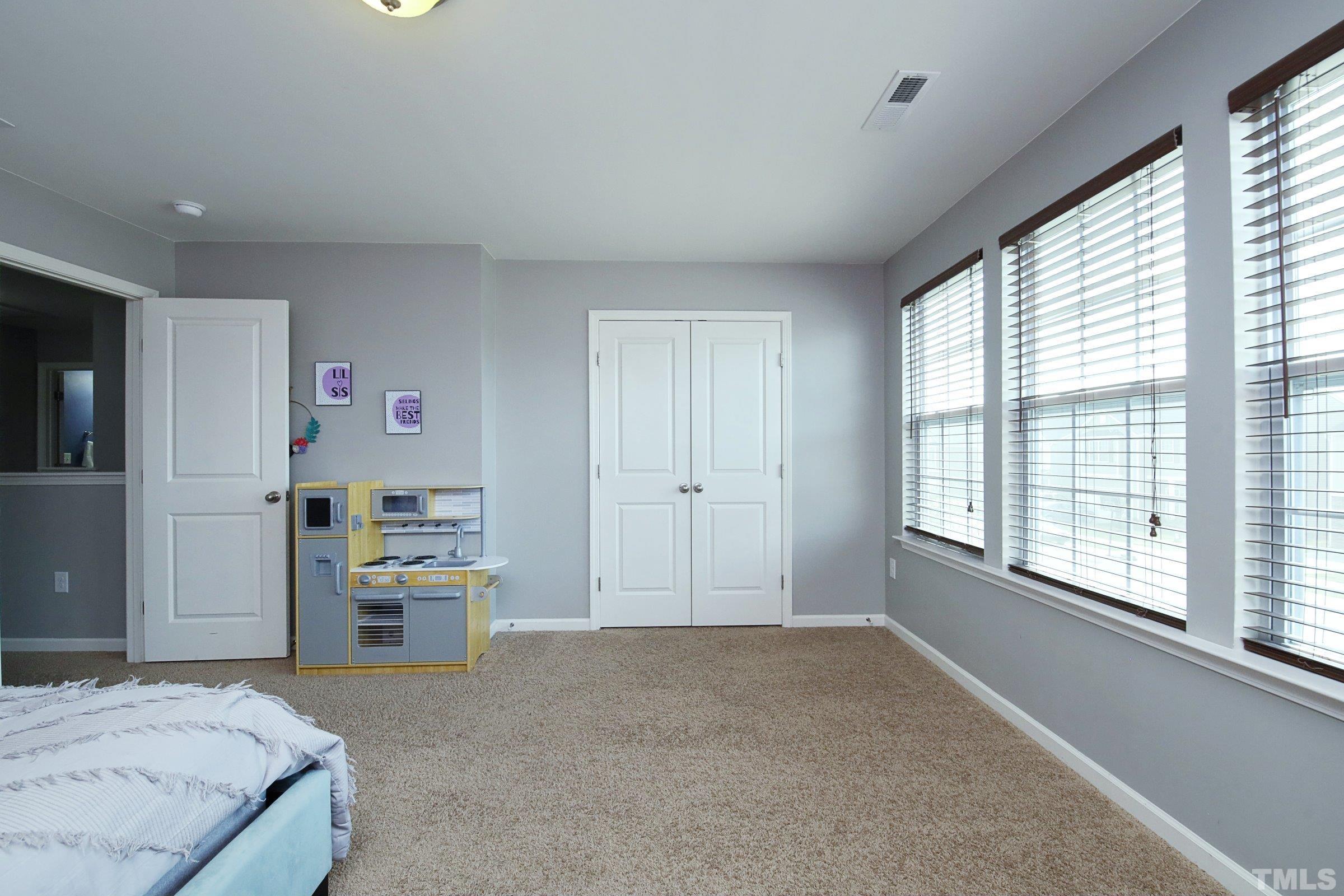 3617 Waleback Lane Raleigh, NC 27610 - Photo 31 of 34 a bedroom with a bed furniture and a window