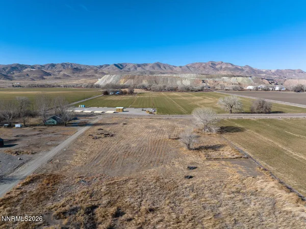 a view of a field with an ocean
