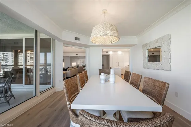 a bedroom with a large bed and a large window