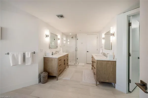a white bath tub sitting in a bathroom