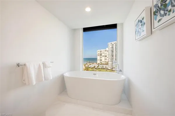 a bathroom with a tub and shower