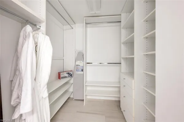 a bedroom with a bed and a cabinets