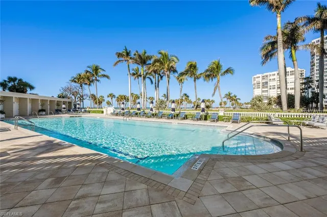 a view of a swimming pool with a patio