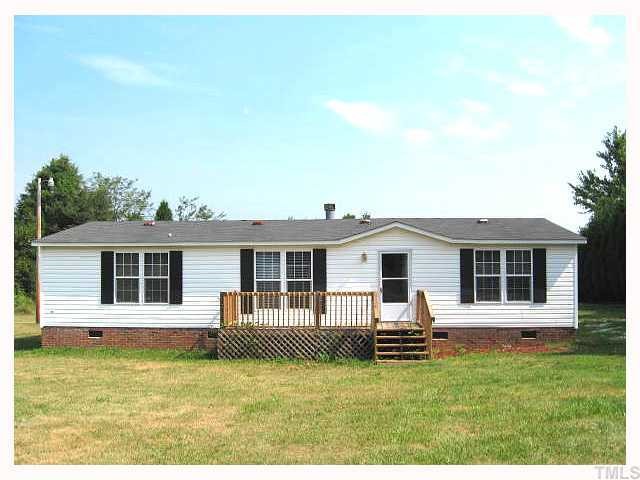 2585 Lucy Garrett Road Timberlake, NC 27583 - Photo 1 of 12 a view of a house with a backyard
